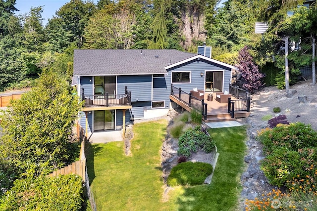 11520 3rd Ave NW, Seattle, WA 98177 - rear view of property featuring a deck, roof with shingles, and a chimney