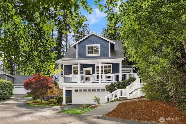 10290 NE Ruddy Duck Ln, Bainbridge Island, WA 98110 - view of front of home featuring covered porch, driveway, stairway, and a shingled roof