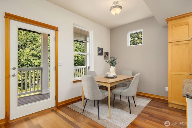10290 NE Ruddy Duck Ln, Bainbridge Island, WA 98110 - dining room with light wood-style flooring and baseboards