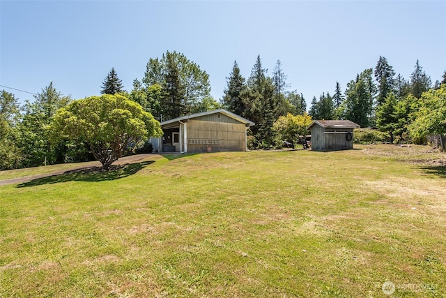 723 W 15th St, Port Angeles, WA 98363 - view of green lawn with a storage unit