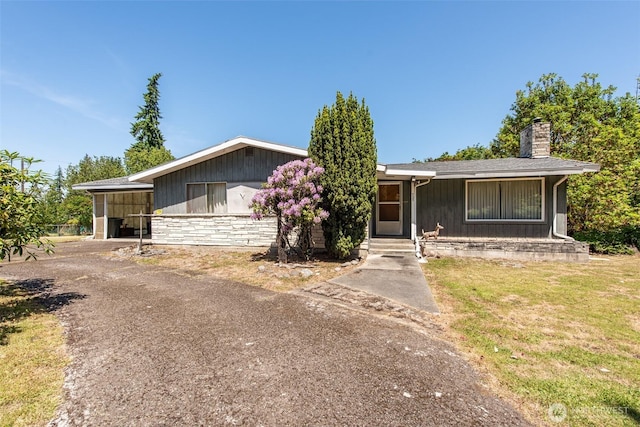 723 W 15th St, Port Angeles, WA 98363 - view of front of house with a chimney and a front lawn
