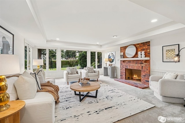 9416 NE 25th St, Clyde Hill, WA 98004 - living area with a raised ceiling, a brick fireplace, recessed lighting, and crown molding