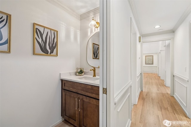 9416 NE 25th St, Clyde Hill, WA 98004 - bathroom with vanity, ornamental molding, and wood finished floors