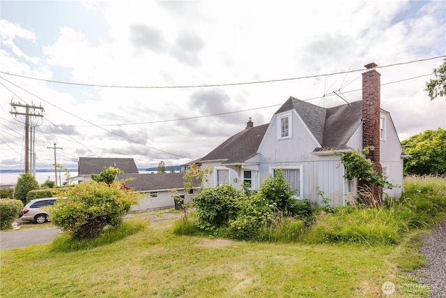 7936 E Main St, Port Orchard, WA 98366 - view of side of home with a chimney and roof with shingles