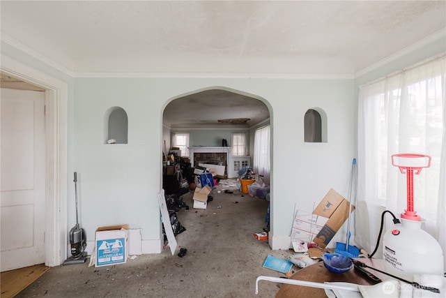 7936 E Main St, Port Orchard, WA 98366 - interior space featuring arched walkways, healthy amount of natural light, crown molding, and a fireplace