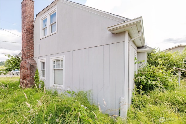 7936 E Main St, Port Orchard, WA 98366 - view of home's exterior with a chimney