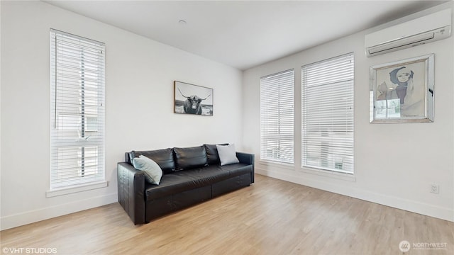 1300 E Remington Ct Unit A, Seattle, WA 98122 - living area with a wall mounted AC and wood finished floors
