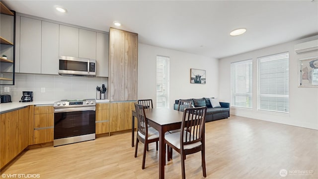 1300 E Remington Ct Unit A, Seattle, WA 98122 - kitchen featuring stainless steel appliances, light wood-type flooring, modern cabinets, open shelves, and recessed lighting