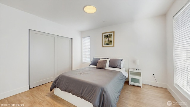 1300 E Remington Ct Unit A, Seattle, WA 98122 - bedroom featuring light wood finished floors and a closet
