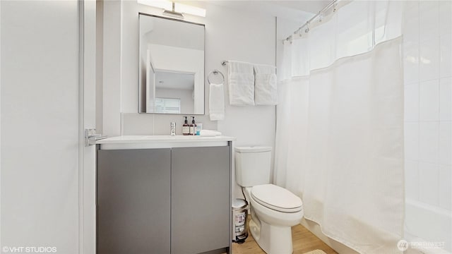 1300 E Remington Ct Unit A, Seattle, WA 98122 - bathroom with vanity, shower / bath combination with curtain, and wood finished floors