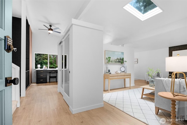 20201 45th Dr SE, Bothell, WA 98012 - corridor with light wood-style flooring, a skylight, and lofted ceiling