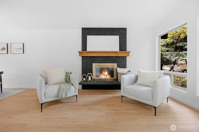 20201 45th Dr SE, Bothell, WA 98012 - sitting room with a brick fireplace and light wood finished floors