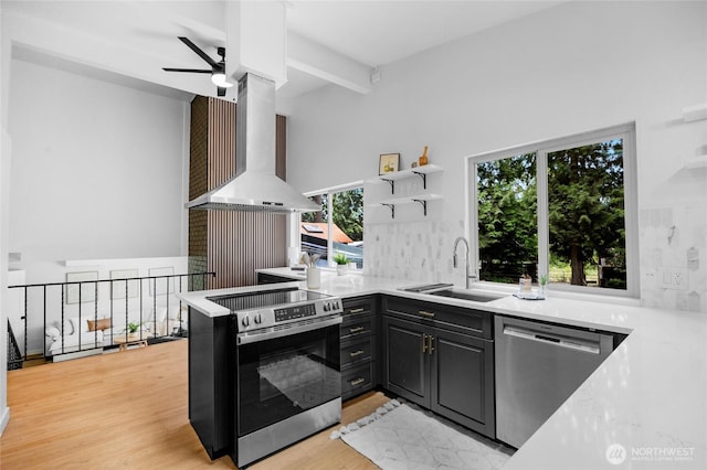 20201 45th Dr SE, Bothell, WA 98012 - kitchen featuring stainless steel appliances, wall chimney exhaust hood, open shelves, tasteful backsplash, and light countertops