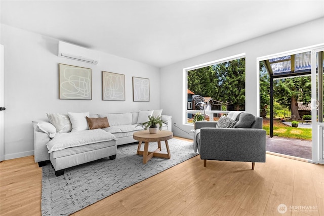 20201 45th Dr SE, Bothell, WA 98012 - living room featuring a wall mounted air conditioner and light wood-type flooring