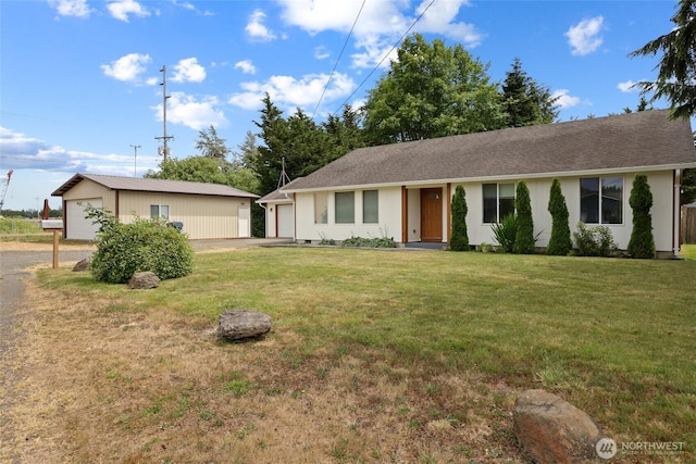 421 E Marion St, Aberdeen, WA 98520 - ranch-style home featuring a front lawn, a garage, and an outbuilding