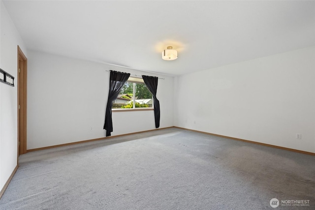 421 E Marion St, Aberdeen, WA 98520 - carpeted spare room with baseboards