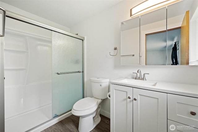 421 E Marion St, Aberdeen, WA 98520 - full bathroom with wood finished floors, vanity, and a stall shower