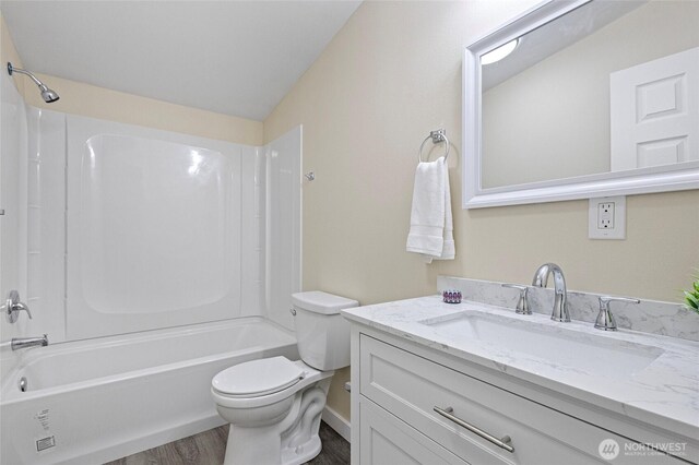 1320 N Oak Harbor St Unit 1, Oak Harbor, WA 98277 - full bathroom with vanity, wood finished floors, and shower / washtub combination