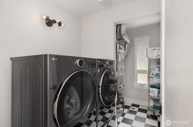 18114 NE 23rd St, Redmond, WA 98052 - laundry room featuring separate washer and dryer and tile patterned floors