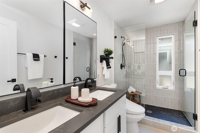18114 NE 23rd St, Redmond, WA 98052 - bathroom featuring a shower stall, double vanity, and tile patterned flooring