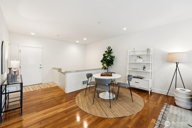 2551 Thorndyke Ave W Unit 203, Seattle, WA 98199 - dining area featuring wood finished floors and recessed lighting