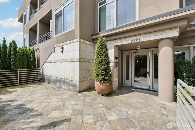 2551 Thorndyke Ave W Unit 203, Seattle, WA 98199 - doorway to property with stucco siding