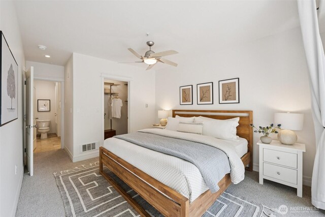 2551 Thorndyke Ave W Unit 203, Seattle, WA 98199 - bedroom featuring carpet floors, ceiling fan, and connected bathroom