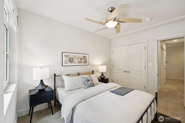 2551 Thorndyke Ave W Unit 203, Seattle, WA 98199 - bedroom with carpet floors, a closet, and a ceiling fan