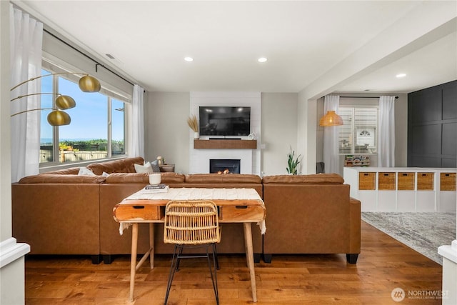 2211 56th St SE, Auburn, WA 98092 - living room featuring a large fireplace, wood finished floors, and recessed lighting