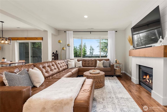 2211 56th St SE, Auburn, WA 98092 - living room with a tiled fireplace, wood finished floors, and recessed lighting