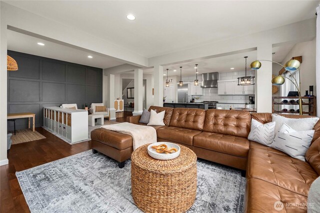 2211 56th St SE, Auburn, WA 98092 - living room featuring a decorative wall, dark wood finished floors, and recessed lighting