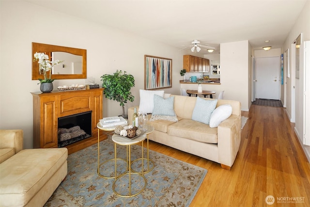 414 Lakeside Ave S Unit 13, Seattle, WA 98144 - living area with wood finished floors, ceiling fan, and a fireplace