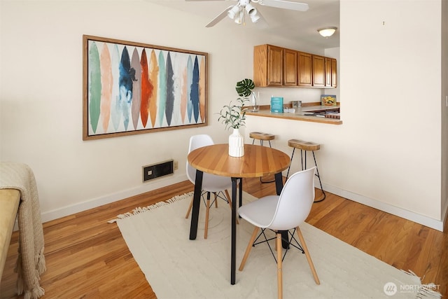 414 Lakeside Ave S Unit 13, Seattle, WA 98144 - dining room featuring light wood finished floors and ceiling fan