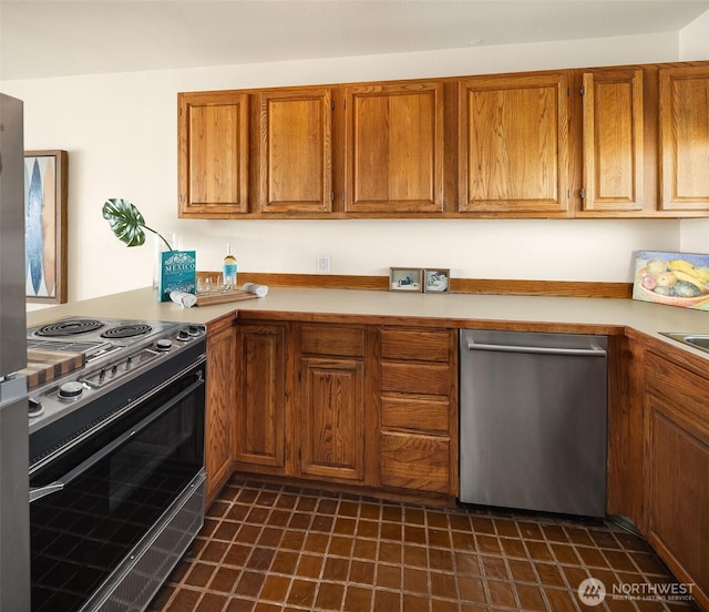 414 Lakeside Ave S Unit 13, Seattle, WA 98144 - kitchen with stainless steel appliances, brown cabinetry, and light countertops
