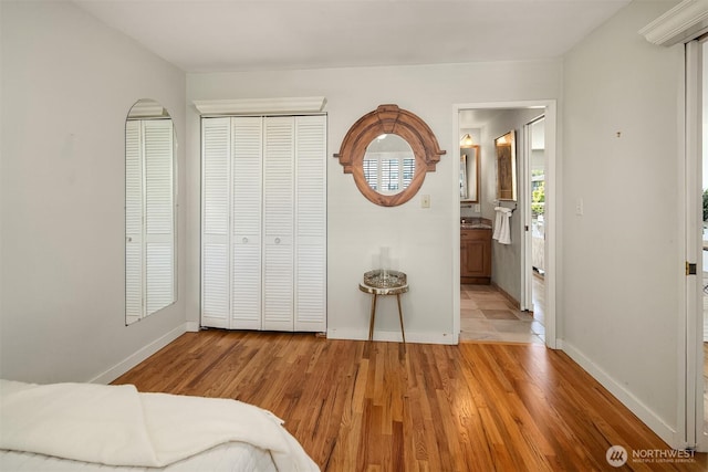 414 Lakeside Ave S Unit 13, Seattle, WA 98144 - bedroom with light wood-style flooring and ensuite bathroom