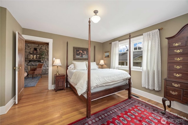 902 Washington St, Wenatchee, WA 98801 - bedroom with light wood-style flooring and baseboards