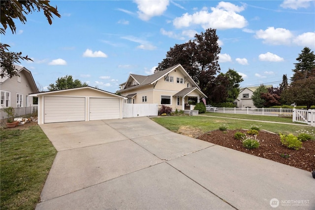 902 Washington St, Wenatchee, WA 98801 - view of front of house featuring a garage and an outbuilding