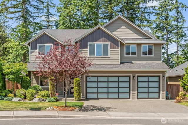 7176 Teal Loop, Gig Harbor, WA 98335 - view of front of house with roof with shingles, a garage, and asphalt driveway