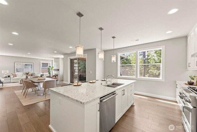 7176 Teal Loop, Gig Harbor, WA 98335 - kitchen with dishwasher, double oven range, white cabinets, hardwood / wood-style floors, and recessed lighting