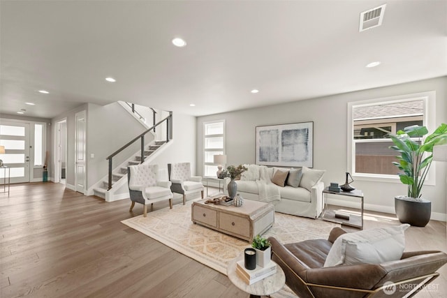 7176 Teal Loop, Gig Harbor, WA 98335 - living area featuring light wood finished floors, stairway, and recessed lighting