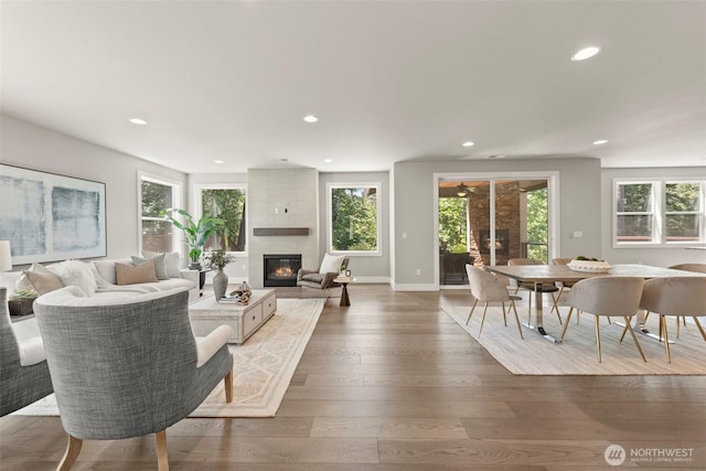 7176 Teal Loop, Gig Harbor, WA 98335 - living room featuring plenty of natural light, recessed lighting, a large fireplace, and wood-type flooring