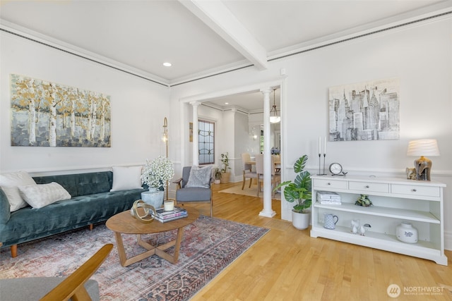 2707 4th Ave W, Seattle, WA 98119 - living area with decorative columns, ornamental molding, light wood-style floors, beamed ceiling, and recessed lighting