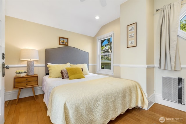 2707 4th Ave W, Seattle, WA 98119 - bedroom featuring wood finished floors, lofted ceiling, recessed lighting, and ceiling fan