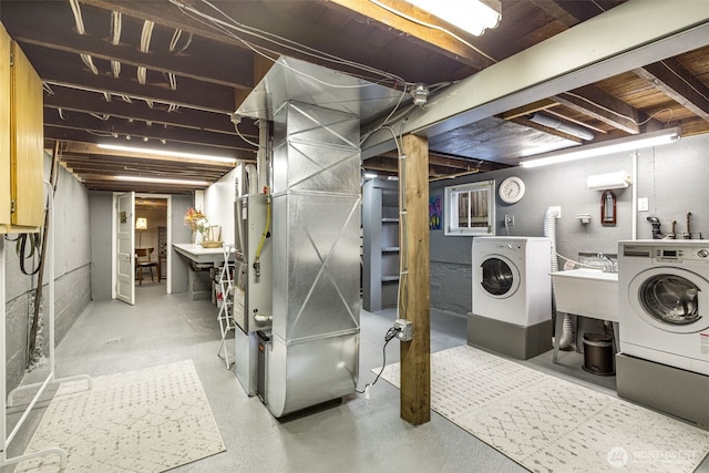 2707 4th Ave W, Seattle, WA 98119 - unfinished below grade area with washing machine and clothes dryer and a sink