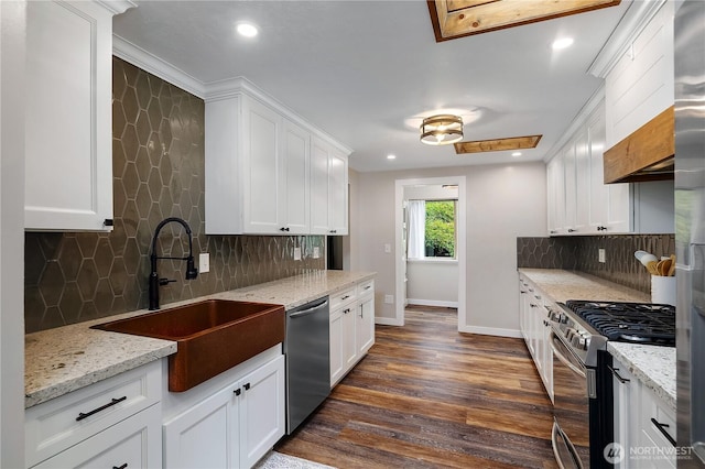 4121 54th Street Ct NW, Gig Harbor, WA 98335 - kitchen with stainless steel appliances, decorative backsplash, white cabinetry, dark wood finished floors, and recessed lighting