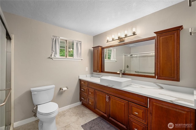 4121 54th Street Ct NW, Gig Harbor, WA 98335 - full bathroom featuring vanity, a shower with shower door, and a textured ceiling