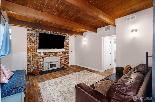 4121 54th Street Ct NW, Gig Harbor, WA 98335 - living area with a wooden ceiling with exposed beams, wood finished floors, and a wood stove