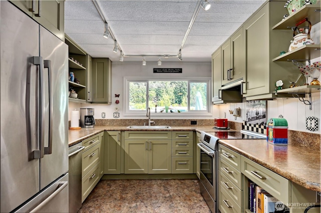 16300 NE State Highway 305 Unit 18, Poulsbo, WA 98370 - kitchen with stainless steel appliances, green cabinets, open shelves, and rail lighting