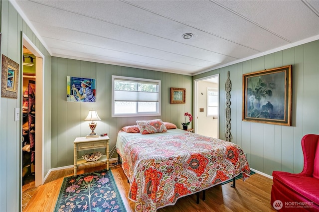 16300 NE State Highway 305 Unit 18, Poulsbo, WA 98370 - bedroom with wood finished floors and a textured ceiling