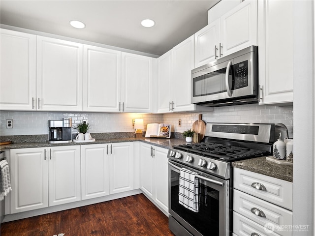 800 96th Ave NE Unit H202, Lake Stevens, WA 98258 - kitchen with stainless steel appliances, white cabinets, dark wood-style floors, tasteful backsplash, and recessed lighting
